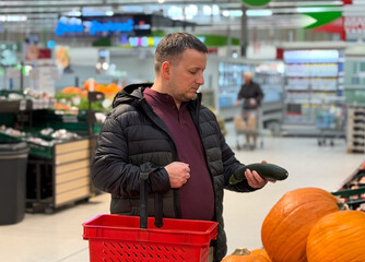 Man shopping for vegetables in grocery store