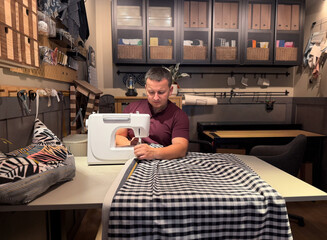 Man sewing fabric in a creative workspace