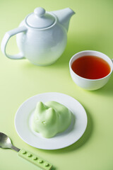 Vanilla apple panna cotta in the form of cat in a plate