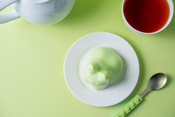 Vanilla apple panna cotta in the form of cat in a plate