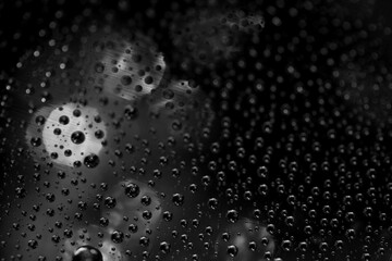 Abstract background texture drops of water and art light on glass. Creative space design