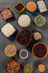 several pots with raw grains for preparing healthy food