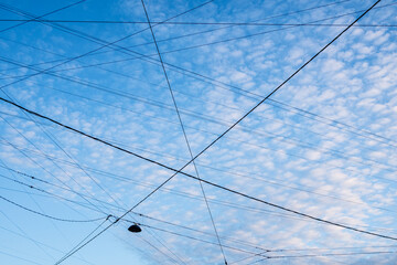electrical wires and cables on street and blue sky