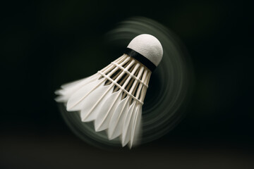 Shuttlescock in motion with a blurred spinning effect background