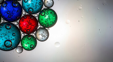 Close-up of colorful liquid bubbles of different sizes, showcasing vibrant hues and dynamic reflections, representing diversity, science, or abstract art