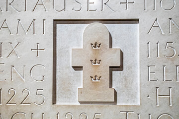 symbol of the three kings carved into a stone in the cathedral.