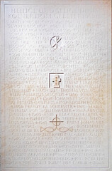 symbol of the three kings, a Christian symbol, and the symbol of Christ carved into stone in the cathedral.