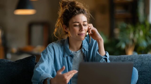 Casual freelancer answering client calls on a laptop in a cozy home office highlighting adaptable and efficient remote call management.