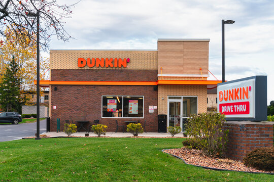 Dewitt, NY - Nov 8, 2025: Dunkin&rsquo; is a global coffee and breakfast chain offering hot and iced drinks, donuts, and sandwiches across 14,000+ locations with drive-thru and mobile ordering