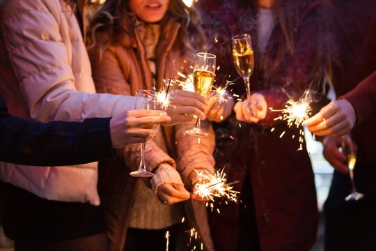 Beautiful sparklers at night. Enjoy holiday - Powered by Adobe