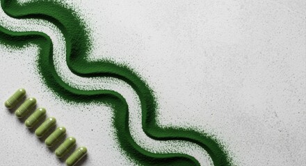 green spirulina powder and capsules on white background in creative wave pattern