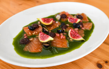 Gourmet Salmon Carpaccio with Fresh Figs, Berries, and Green Herb Sauce