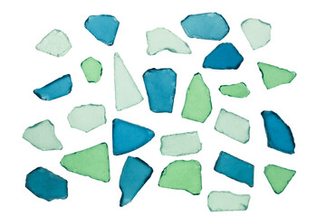Backlit pieces of sea glass isolated on white background