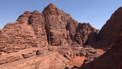 Fototapeta premium A trip to Wadi Rum desert in Jordan. Beautiful african travel photo. Mountains, rocks, canyon, nature. Summer vacation in arab country. Moon Valley. Martian desert.