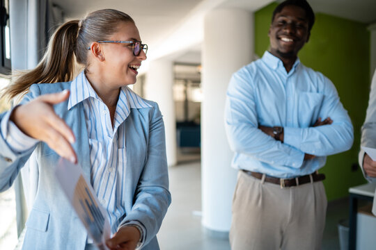 Successful multicultural business team sharing ideas together