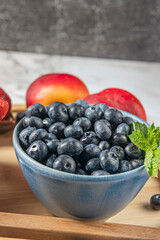 Blueberries in light syrup float in a clear canning jar, retaining their shape and vibrant color.