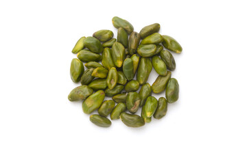 peeled pistachios on a white background