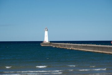 Concrete and stone pier leading out to the Sodus Point Lighthouse Lake Ontario New York State