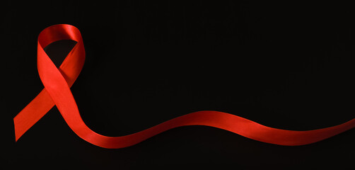red ribbon symbol of World AIDS Day. Top view. Free copy space.