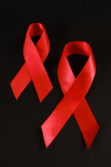 red ribbon symbol of World AIDS Day. Top view. Free copy space.