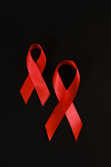 red ribbon symbol of World AIDS Day. Top view. Free copy space.