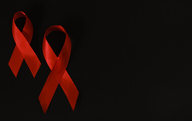red ribbon symbol of World AIDS Day. Top view. Free copy space.