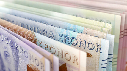 Close up of Swedish krona banknotes in various colors representing national currency