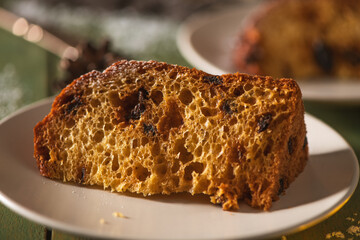 Detailed Close-up of a Single Panettone Slice on a White Plate