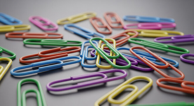 Chaotic Creativity: A Pile of Colorful Office Supplies
A close-up, high-angle shot captures a vibrant, disorganized pile of classic metal paper clips scattered across a smooth