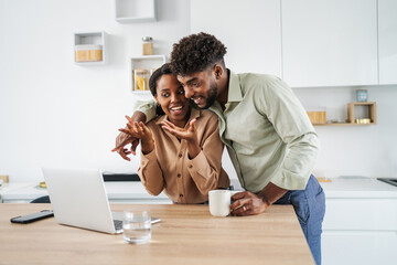 African american couple feeling surprised receiving good news