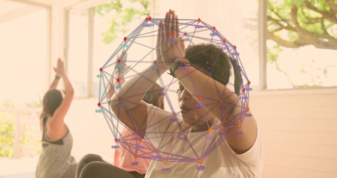 Practicing center woman in activewear pressing palms overhead in yoga studio with mats, 3D overlay