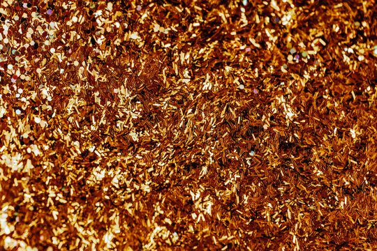 Festive New Year and Christmas Wallpaper. Gold Glitter Confetti Texture Background. gold wallpaper.Sparkling Gold Glitter Texture. Golden relief texture.Shimmering gold texture. - Powered by Adobe