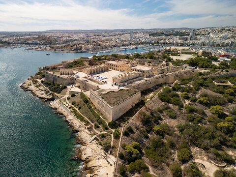 Malta Manoel Island panorama with historic Fort Manoel and Sliema creek yacht bay aerial drone view.

