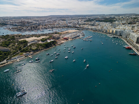 Malta Manoel Island panorama with historic Fort Manoel and Sliema creek yacht bay aerial drone view.
