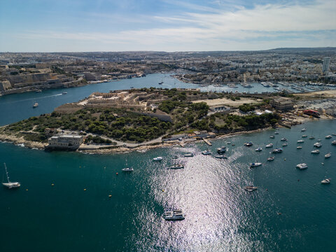 Malta Manoel Island panorama with historic Fort Manoel and Sliema creek yacht bay aerial drone view.
