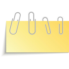 Yellow sticky note with four silver paper clips attached against a white background with soft shadow effect