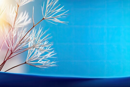 Close-up of delicate white feathery seed heads with thin stems, set against a vibrant, textured blue background illuminated by a warm sunbeam.
