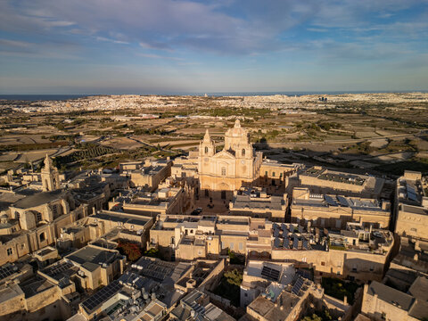 Malta Mdina old town historic walled city with St Pauls cathedral aerial drone view.
