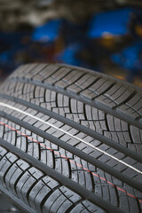 New tire is placed on the tire storage rack in the tire industrial. Be prepared for vehicles that need to change tires.
