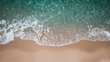 Aerial View of Waves Lapping on Sandy Shoreline in Soft Light