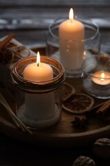 Christmas lanterns, matches and spices on table, closeup