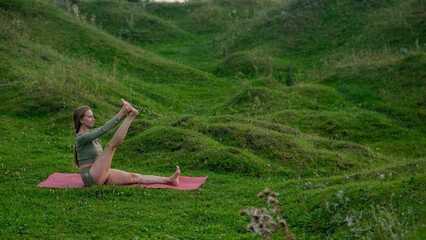 Caucasian woman doing yoga outdoors. 