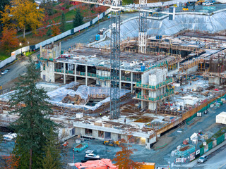 Multilevel Construction Site Underway With Crane and Workers in Burnaby, BC