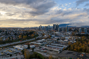 Evening City Skyline Over Burnaby Industrial Area With High Rise Towers and Autumn Trees