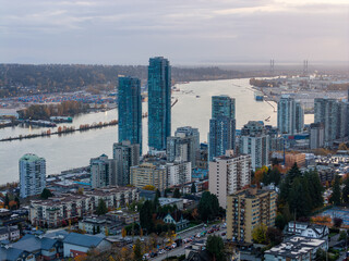 Fototapeta premium New Westminster Skyline Over The Fraser River With Tall Blue Towers And Waterfront View