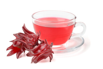 Roselle water in a clear cup with fresh roselle on the side. isolated on white background.