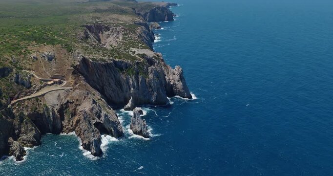 Promontorio della Grotta Azzurra Historical Landmark At Buggerru In The Province Of South Sardinia, Italy. Aerial Drone Shot