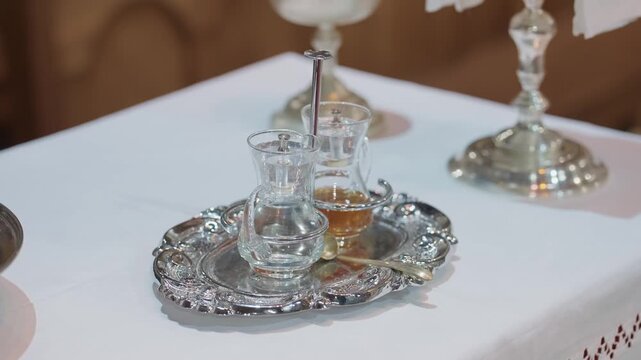 ornate silver cruets with glass vessels prepared for catholic mass