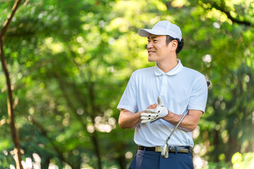 Male golfer wearing golf gloves
