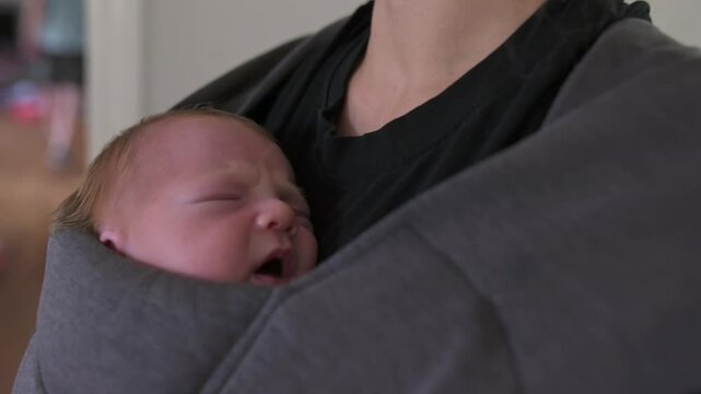 infant cozy cuddle, peaceful scene of baby and caring touch, tender moment of newborn held in soft shelter gently, serene image capturing peaceful infant cradled in comforting fabric embrace
